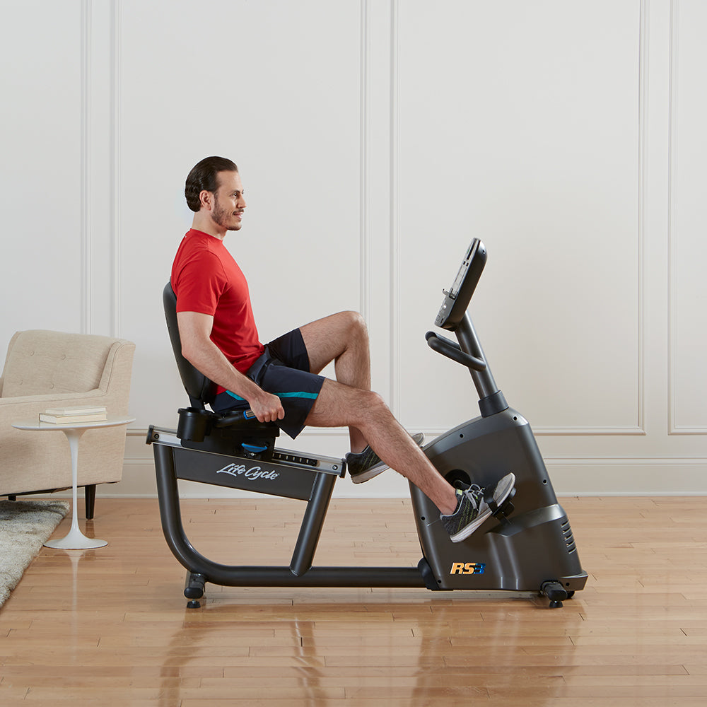 life-fitness-rs3-recumbent-lifecycle-bike-man-pedaling-side-1000x1000-1